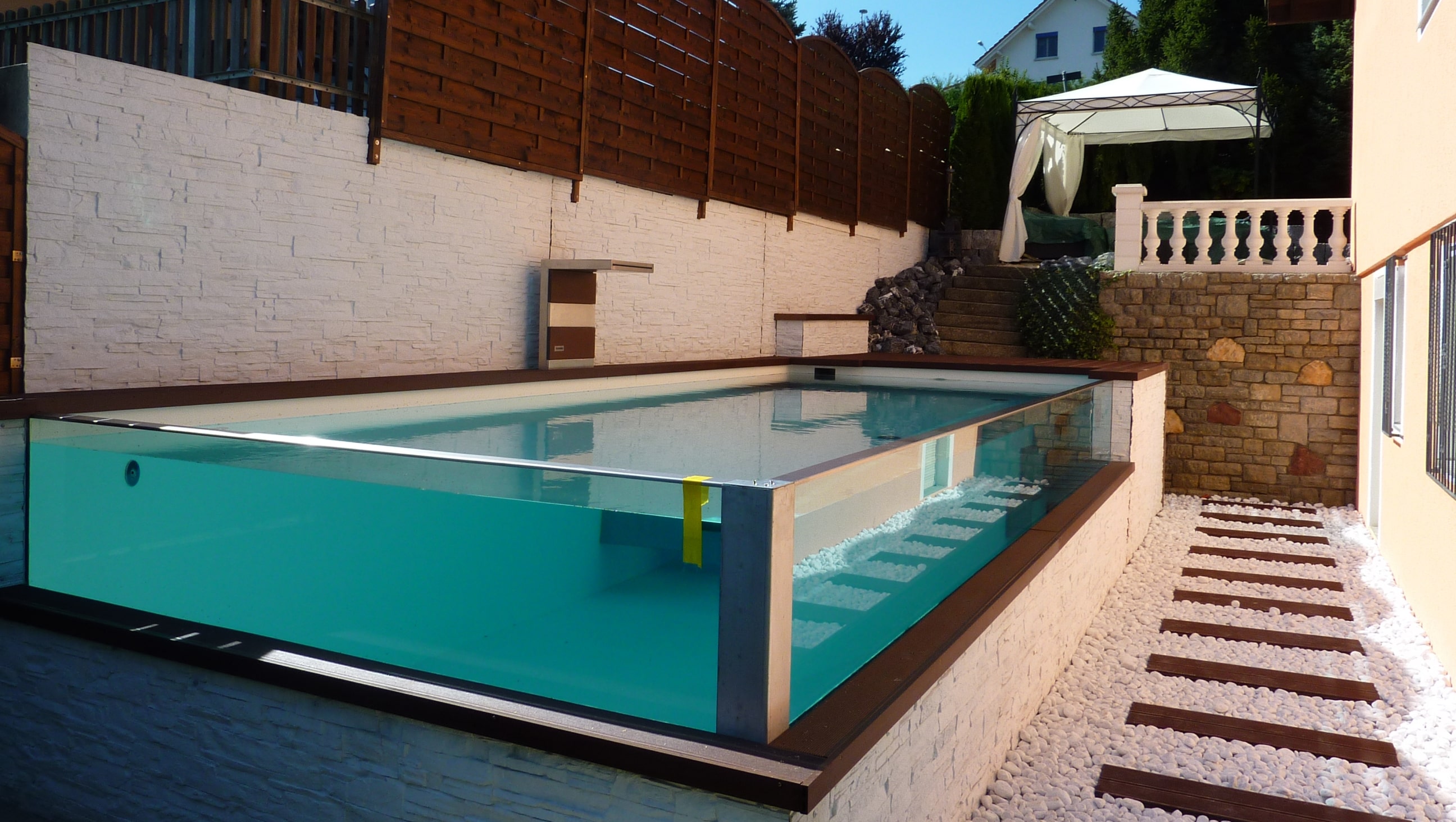 Outdoor pool with glass facades